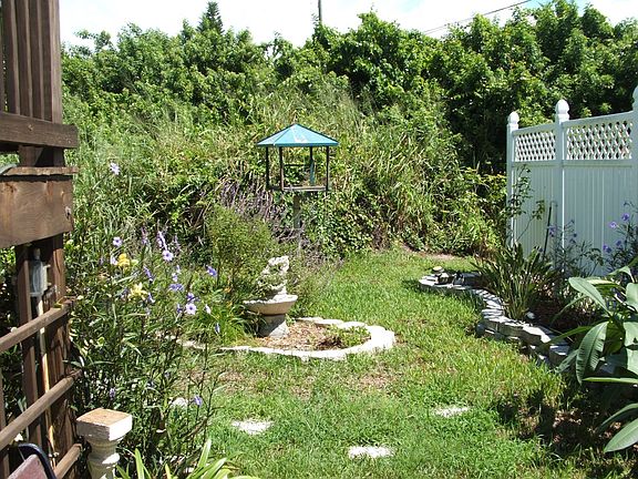 Behind fence NE Garden