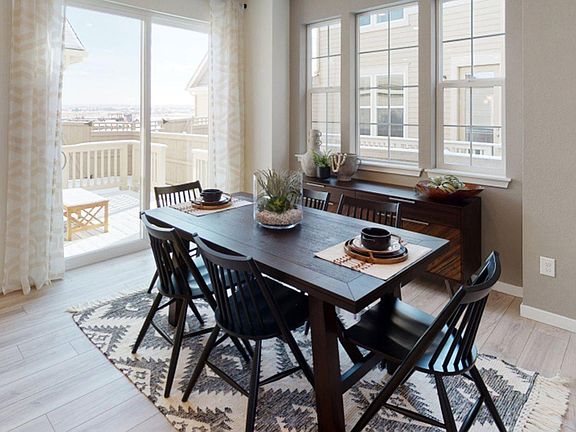Dining area and sliding door to raised deck