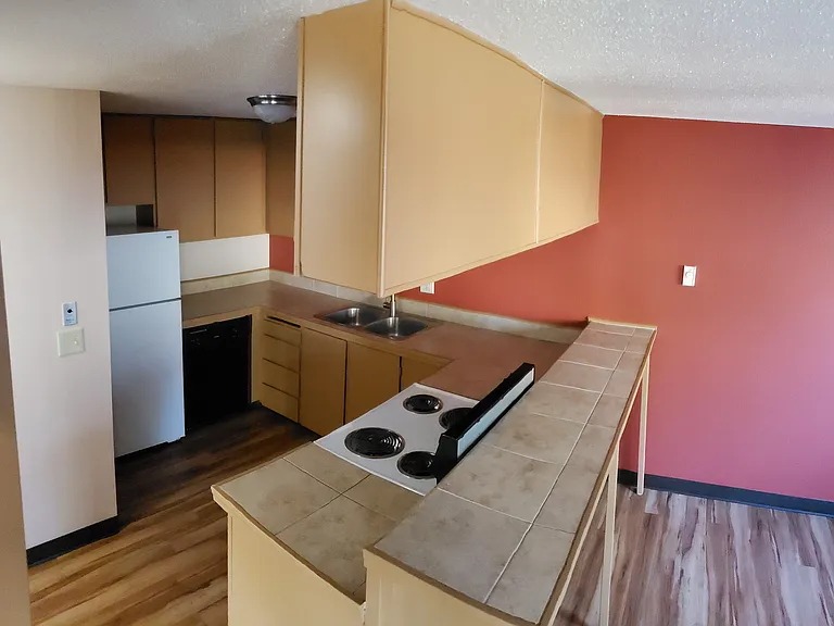 Kitchen and dining room, view from stairs.