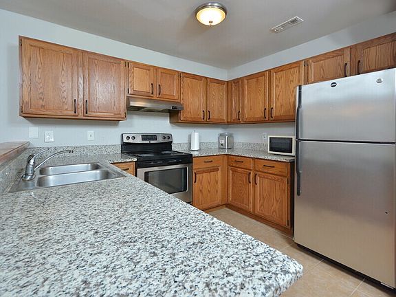 Full kitchen view with refrigerator/freezer