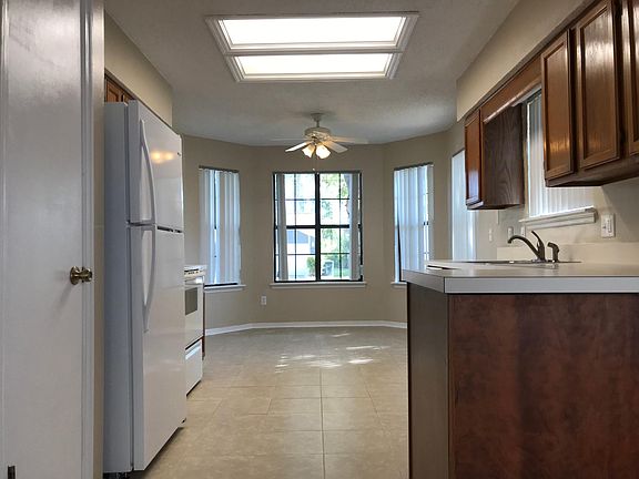 Nice and bright kitchen with lots of cabinets.