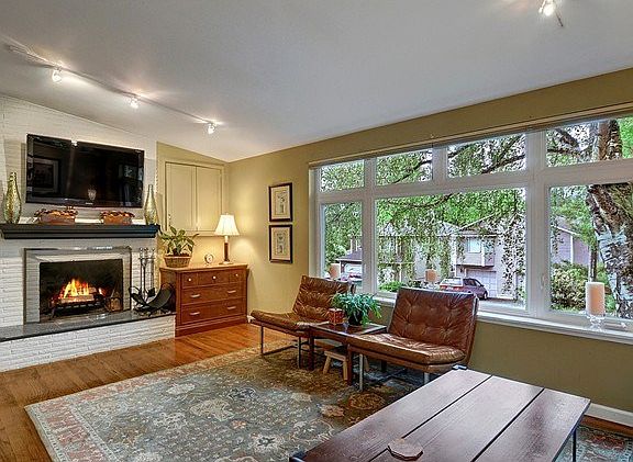 Wood burning fireplace makes a great focal point in the living a