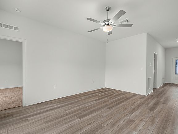 A long foyer leads to the main living area
