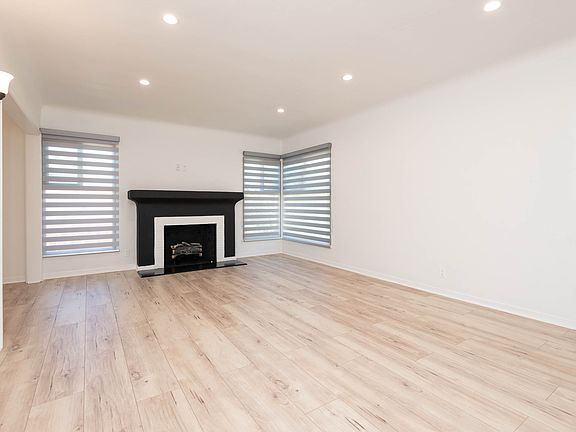 Living Room with Fireplace. Fireplace has been capped for safety reasons only kept for decor.