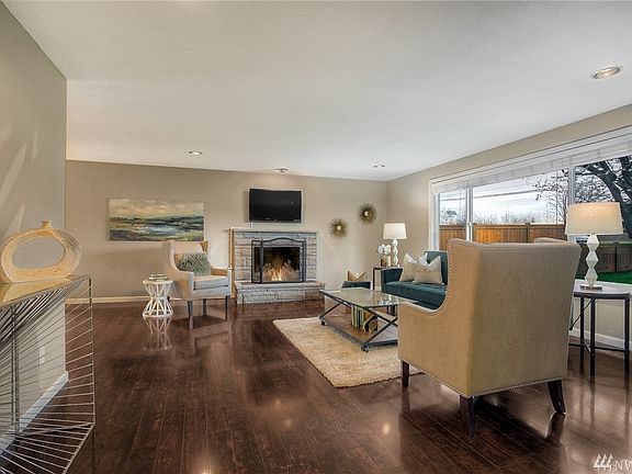 Cozy up to this lovely fireplace in the living room.