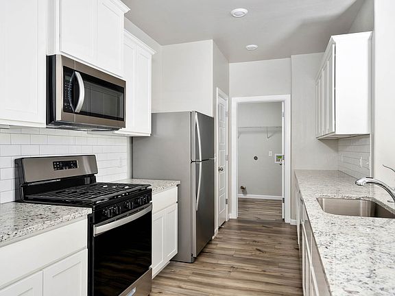 The kitchen of the Klein has a stunning tile backsplash.
