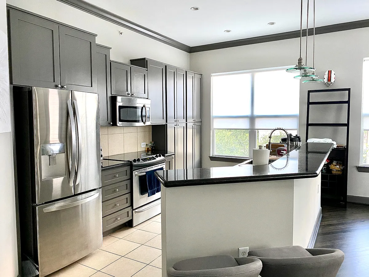 Granite countertops, stainless steel appliances, and your own wine cooler! Beautiful sunlight throughout. - 1010 Rosine St #20
