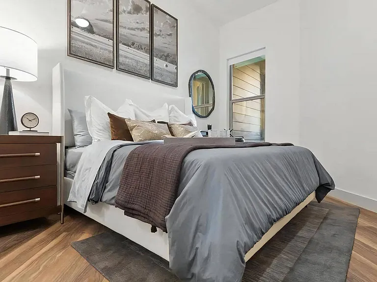Bedroom with King Bed, Nightstand, and Framed Wall Art