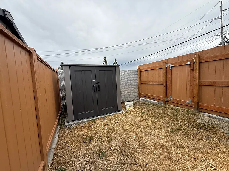 Fully-fenced in backyard area
