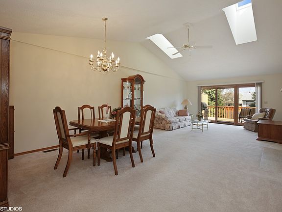 Vaulted ceiling and sky lights add depth to this room!