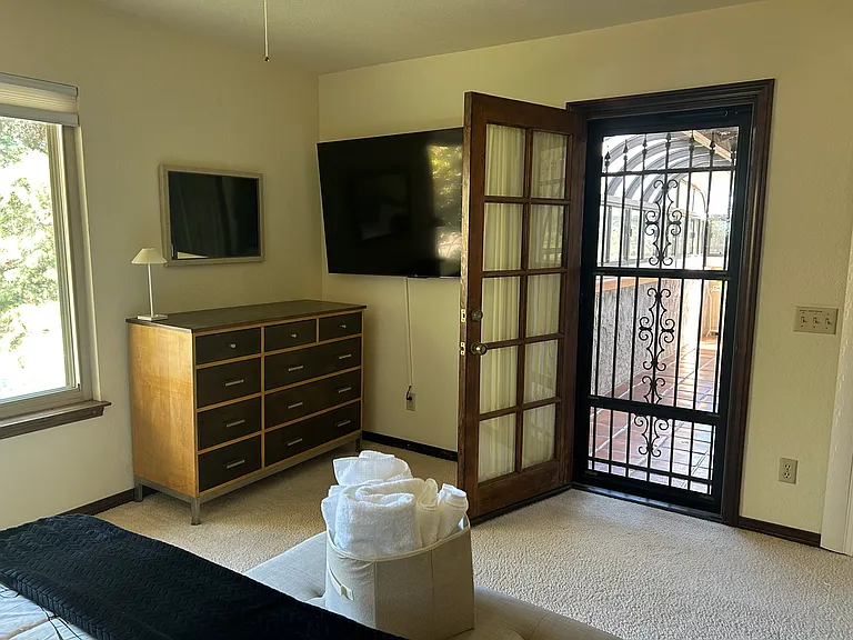 Third bedroom also has access to the upstairs solarium. Close the door for privacy.
