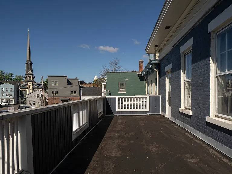 Deck with Stockade rooftop views.