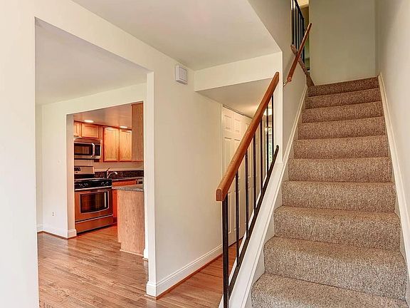 Main entryway looking at the stairs/dining room/kitchen