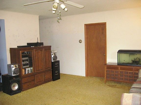 View of kitchen from dining area. Roomy, great lighting and more cabinets.