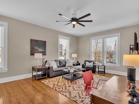 Living room, high ceilings and large windows are all newer and insulated.