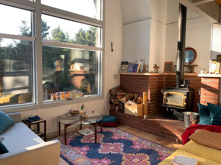 Bright sunny living room that connects super functionally to kitchen and dining
