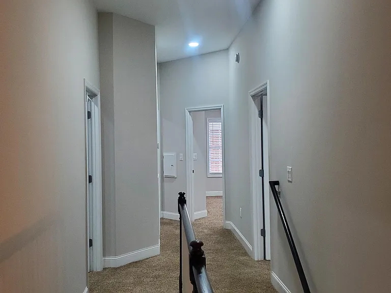 Upstairs view of bedroom entrances
