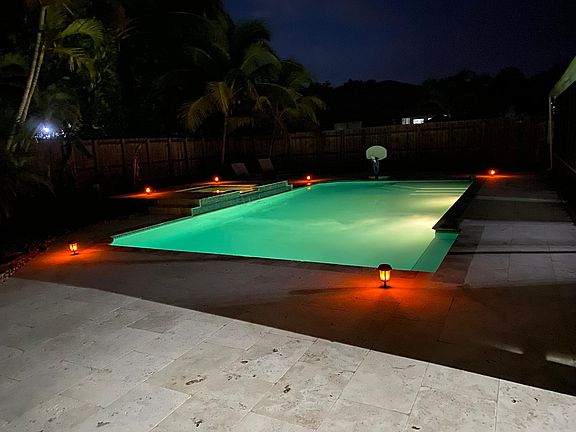 36x30 size saltwater pool with solar lights around which illuminates at night, giving a romantic night and a resort type atmosphere.
