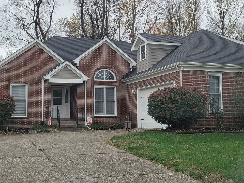 Brick and siding exterior with attached 2 car garage.