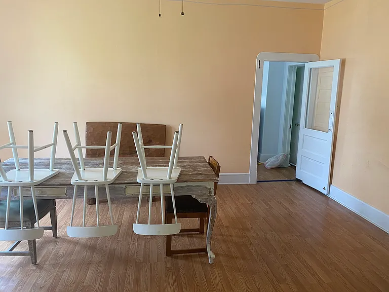 Main Floor Dining Room towards the Kitchen - Dining Table provided with few chairs