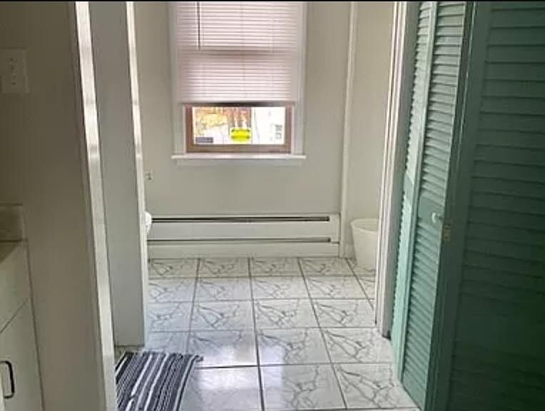 Bathroom with washer & dryer and large closet.