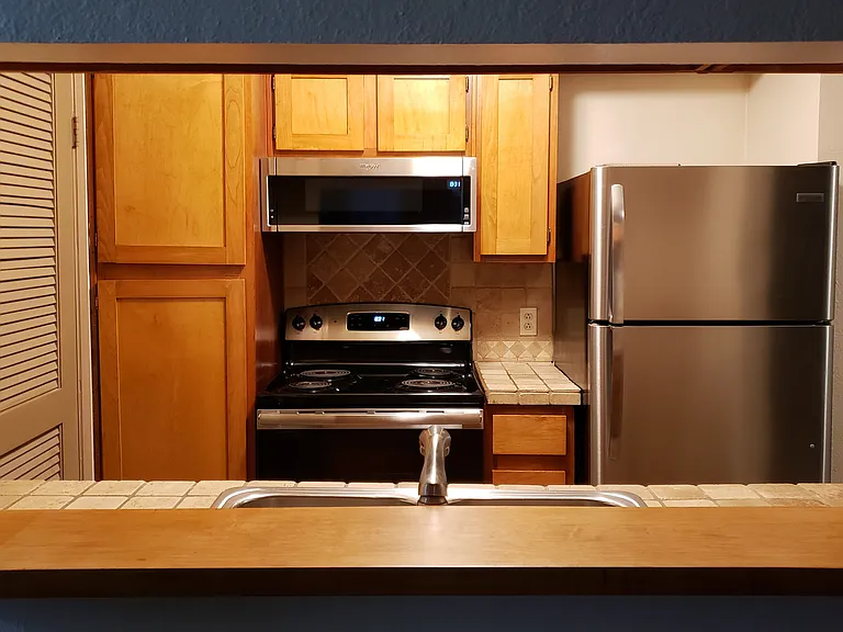 Pass-through from the kitchen maintains the feel of the open floor plan.