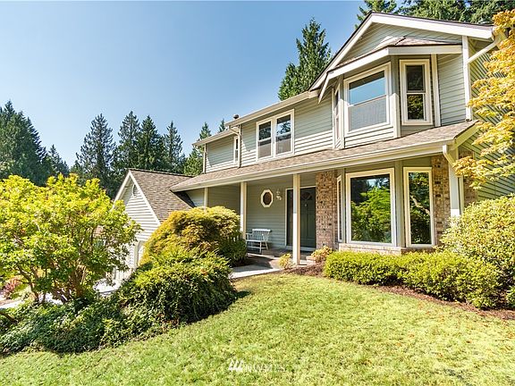 Nicely landscaped front yard area with sprinklers / Covered front porch / dual pane windows, comp roof
