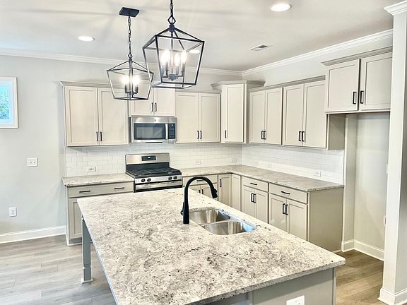 Open concept kitchen, room for barstools at island