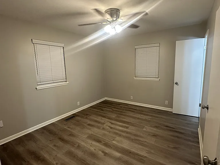 Bedroom 1, Newer Flooring, Lighting and Paint, Private .5 bath, walk in closet.
