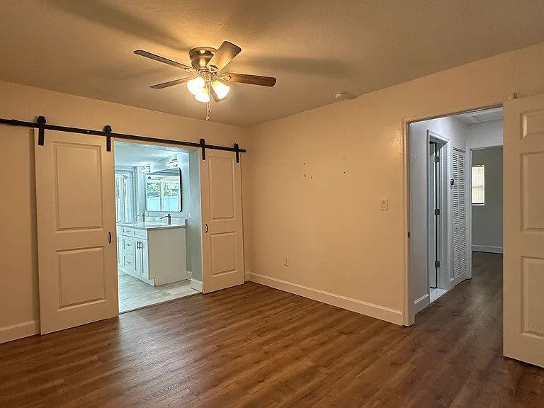 large master bedroom and bathroom