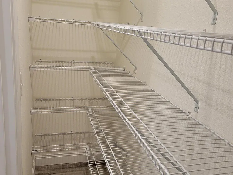 Extra large storage closet off guest bathroom