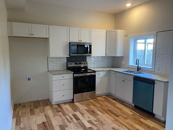 Kitchen . Black refrigerator is installed