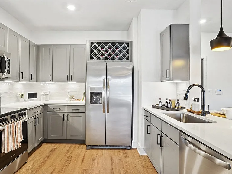 Kitchen with Quartz Countertop and Stainless Steel Appliances.