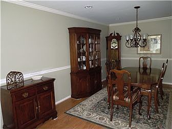 Dining room with hardwood floors and chair rail