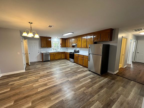 This kitchen is amazing with so much cabinet space and tons of countertops that have been refinished, along with a new refrigerator, stove and dishwasher.