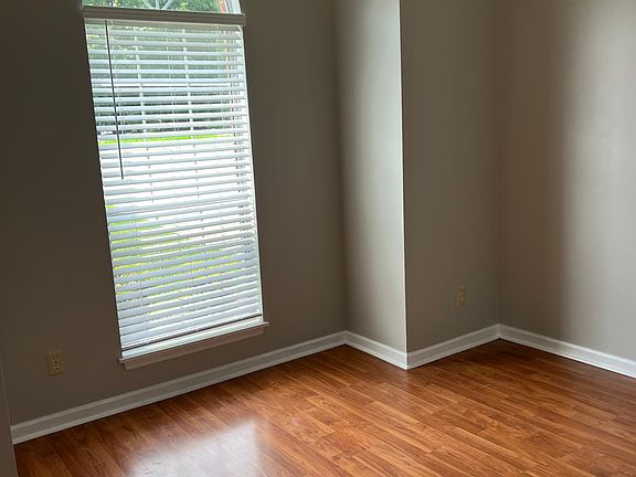 Front bed room with floor length window; views into front full yard
