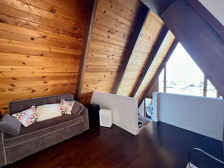 Cozy couch in loft upstairs