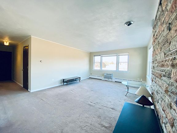 Large Living Area Filled With Natural Light.