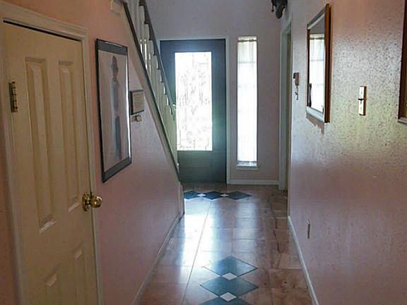 Looking from the kitchen out through the entry to the front