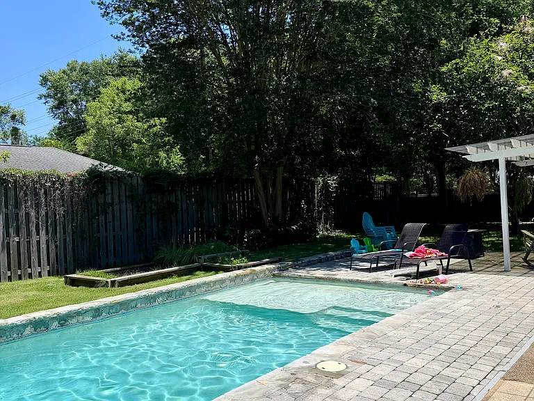 Pool area with fenced yard