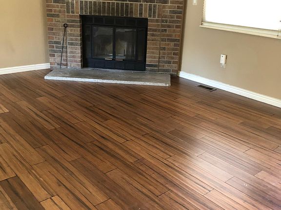 Wood-burning Fireplace in Living Room. Beautiful Wood Floors.