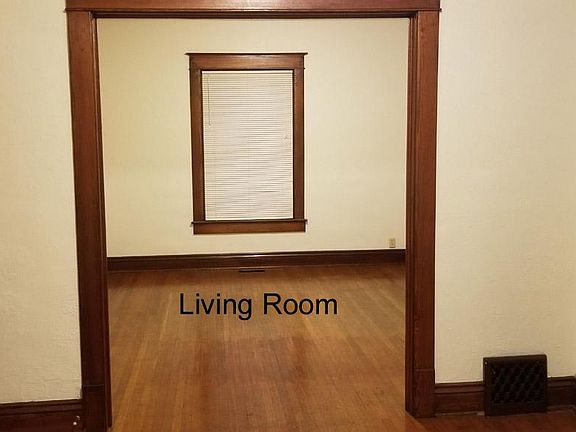 Front entrance door to the right enters the foyer. Turn right into the living room or straight into the kitchen.