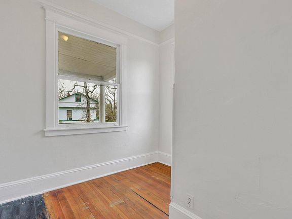 Bedroom 1 - two large windows make this quant bedroom feel airy