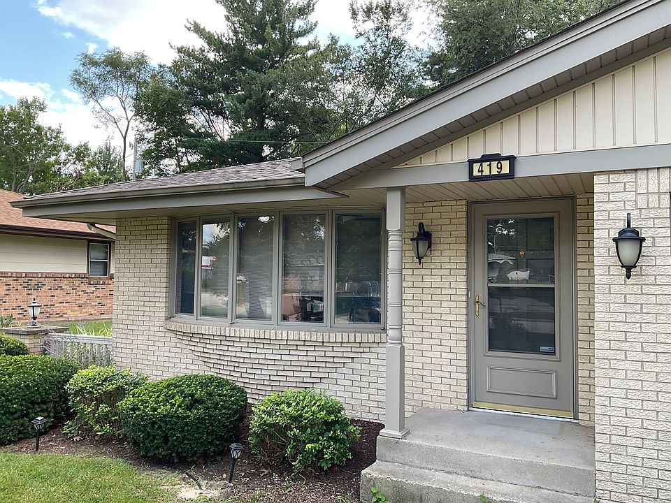 Front door and picture window in living room