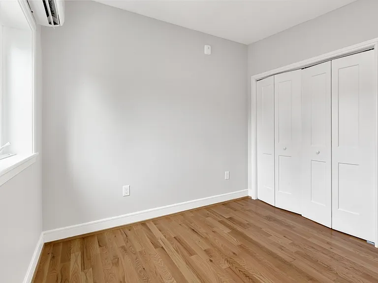 The smaller bedroom has one window and large closet.