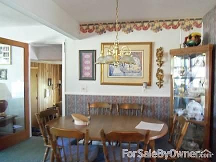 open dining area
						:
						Comfortable open dining area, opens to living room on left, den down two steps