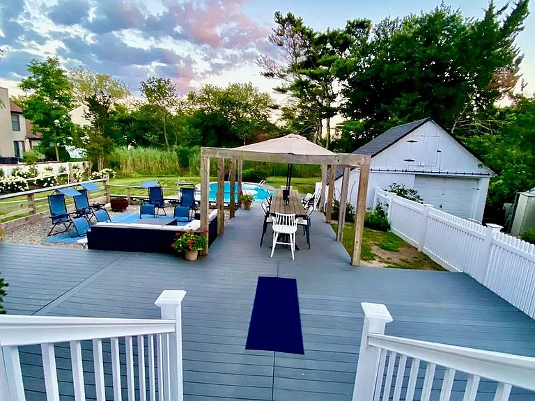 Rear door to deck, pool, garage, driveway