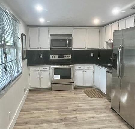 5th image of 4020 W Palm Aire Dr APT 309