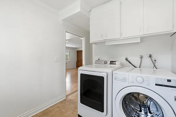 Laundry room with cabinets. Storage shelves (on the left, not shown).