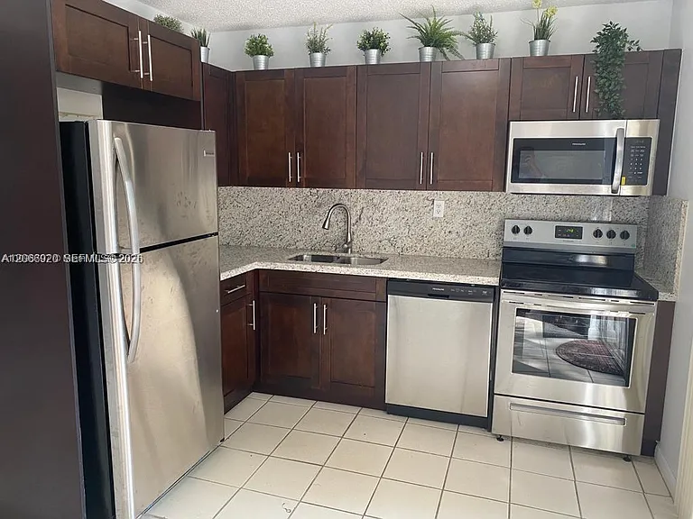 560 NW 82nd Pl #305 — Photo 2